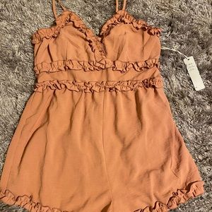 Pink romper size L but its more like a M